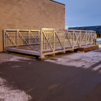 Galvanized steel pedestrian bridge in Coyote Bridges yard ready for installation