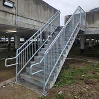 Stainless steel railings installed for stairs by Coyote Bridges