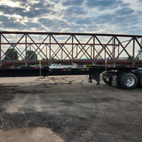 Truss bridge loaded on truck ready for installation, fabricated by Coyote Bridges